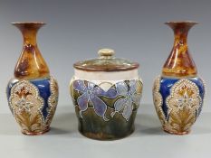 A pair of Doulton Lambeth pedestal vases and a tobacco jar, 17cm tall