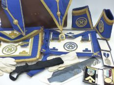 Masonic medal marked silver, ornate apron and other Masonic ephemera in leather case