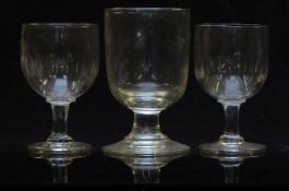 Three Georgian glass rummers including a pair with faceted decoration, largest 14.8cm tall.