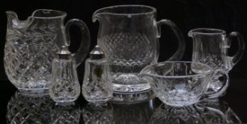 Four Waterford Crystal cut glass jugs, largest 15.5cm tall, together with a matching salt and pepper
