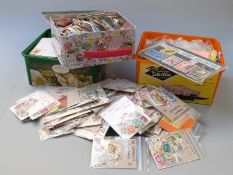 Two boxes of loose all-world stamps in tins and packets