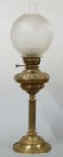 A 19thC Messenger's 54 annular brass oil lamp with etched glass shade, 68cm tall