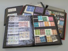 Three stockbooks of GB mint blocks of definitives and commemorative stamps and an empty stockbook