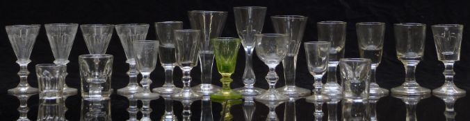 Twenty 19thC and later miniature drinking glasses, some with cut decoration including one uranium