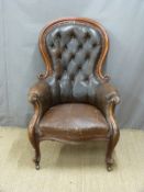 19thC mahogany upholstered button-back armchair with serpentine front and scrolling arms, raised