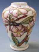 Moorcroft baluster vase in Hibiscus pattern on a cream ground, dated 99 to base, 22cm tall