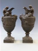 Wedgwood near pair of black basalt pedestal figural ewers decorated with Neptune seated among swags,
