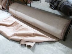 A large bolt of pink velour fabric with hemmed edges, haberdashery / textiles / upholstery