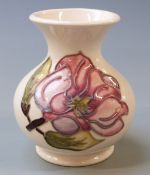 Moorcroft squat pedestal vase in Magnolia pattern on a cream ground, 9cm tall