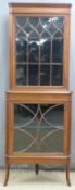 Edwardian mahogany double height glazed corner display cabinet with string inlay and arched and