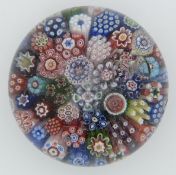 Clichy millefiori glass paperweight with various multi-coloured canes, 43.3cm in diameter.