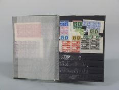 A stockbook of blocks and part sheets of early QEII stamps, large quantity including castles,