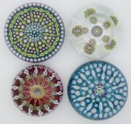 Four millefiori glass paperweights one John Deacons with thistle cane, and three Perthshire