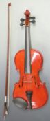Viva handmade full size 20thC violin in flame lacquered finish, labelled by 'Guvnor' no VM1004, 35cm