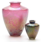 Two Royal Brierley iridescent glass vases, one on cranberry, the other on blue ground, largest