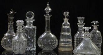 Eight various 19thC and later cut glass decanters including a ship example, one with an unusual