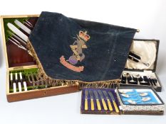 Mahogany cased canteen of cutlery with carving set, further cased cutlery and an embroidered REME