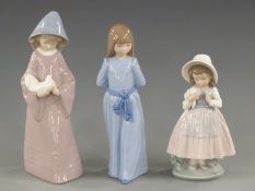 Three Nao figurines, tallest 26cm