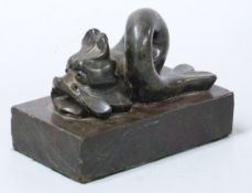 Carved serpentine or similar stone dolphin on similar stone base, length 15cm