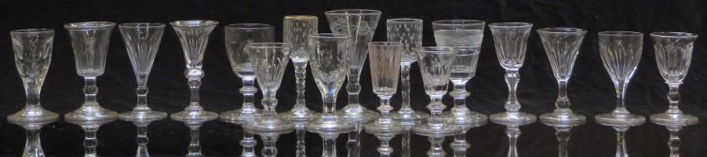 Seventeen 19th century and later drinking glasses including some with gilt, faceted and cut
