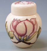 Moorcroft ginger jar in Magnolia pattern on a cream ground, 11cm tall