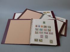 An extensive collection of Commonwealth Queen Elizabeth II stamps in 38 Stanley Gibbons universal