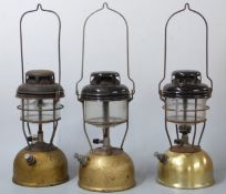Three Tilley lamps