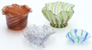 Four Murano/ Venetian style glass dishes in the form of Venini all with latticino decoration, two