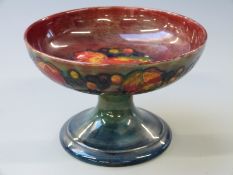William Moorcroft flambé pedestal tazza / comport in Leaf and Berry pattern, signed and impressed '