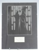 Sir Alec Guinness signed card mounted with a Star Wars photo, overall size 40x30cm
