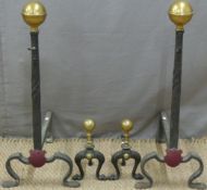 A large pair of fire dogs to support a grate, H71 x D47cm, and a near matching pair of andirons, H25