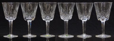A set of six Waterford Crystal Lismore pattern wine glasses, three with original paper labels,
