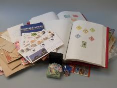 Two stamp albums and a collection of loose stamps