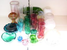 Thirty five pieces of coloured glassware including an Eickholt pulled feather iridescent glass vase,