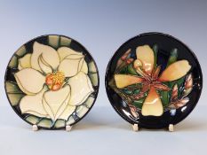 Moorcroft pin dishes decorated with flowers including a Collectors' Club edition 2004 and another