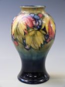 William Moorcroft baluster vase in Leaf and Berry pattern, with impressed and applied label '