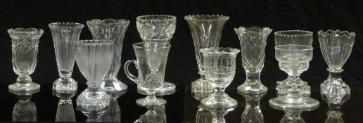 Eleven 19thC and later cut glass vases, some with knopped stems and some raised on square cut bases,