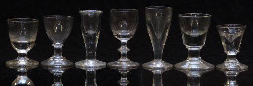Seven 19thC clear glass drinking glasses, largest 10.5cm tall.