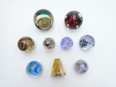 Nine glass paperweights including Macintosh Caithness Round The Twist Series 1 limited edition 1/
