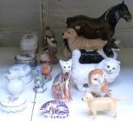 A collection of Beswick, Royal Worcester and Royal Crown Derby bird and animal figures