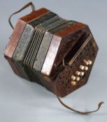German late 19th/early 20thC Anglo concertina with wooden fretwork ends, bone buttons, embossed
