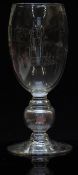Clear glass goblet with engraved decoration of figures blowing glass, monk above the dates 1926-1947