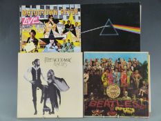 Over 100 LPs of mixed genres and artists including Pink Floyd (DSOTM), Fleetwood Mac, Leonard Cohen,