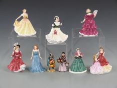 Nine Royal Doulton figures to include two miniature street vendors the Mask Seller and the Orange