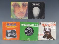 Approximately 30 Beatles/solo singles including EPs and imports