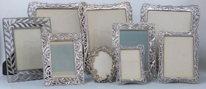 Eleven decorative metal photograph frames with easel backs, largest 32 x 27cm