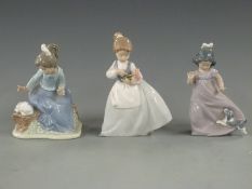 Three Nao figurines, tallest 18cm