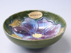 Moorcroft pedestal bowl in Clematis pattern on a green ground