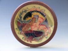 Moorcroft charger decorated with two carp, in frame, diameter 39cm