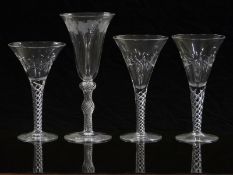 Four air twist drinking glasses, three in the same pattern with cut decoration and one with cut